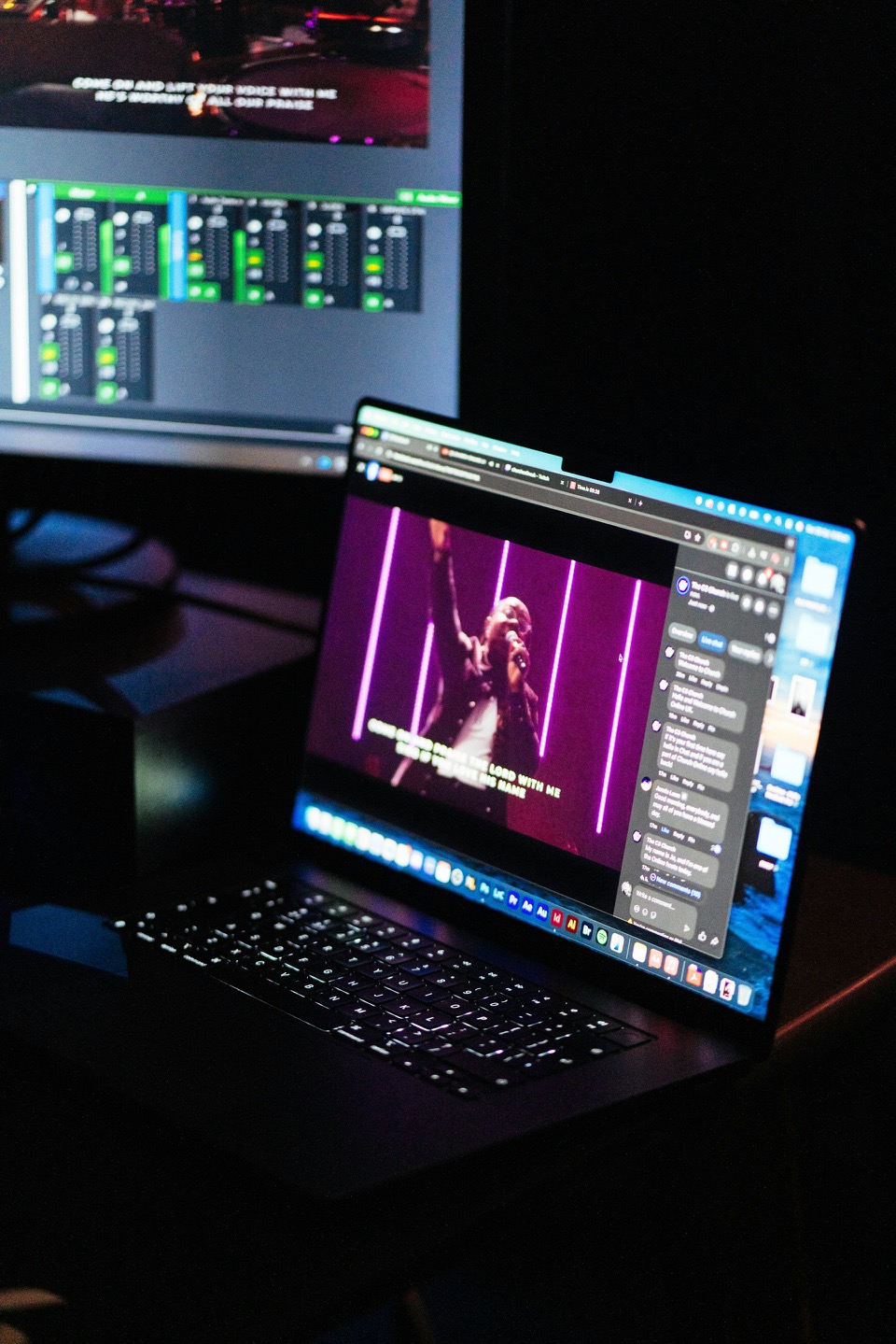 Engineer monitoring church livestream while mixing audio